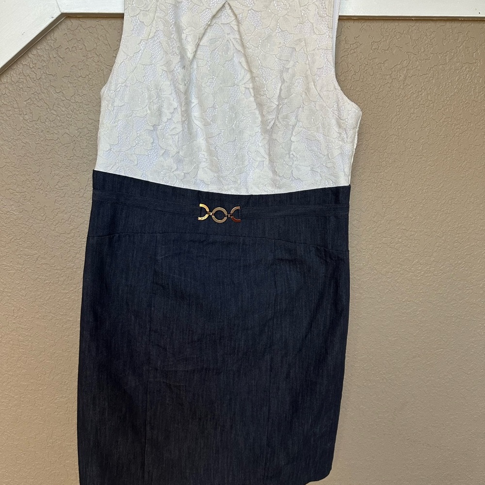 Size 14. Dressbarn.  Worn once to a wedding.  Great lace detail on top. Zip back
